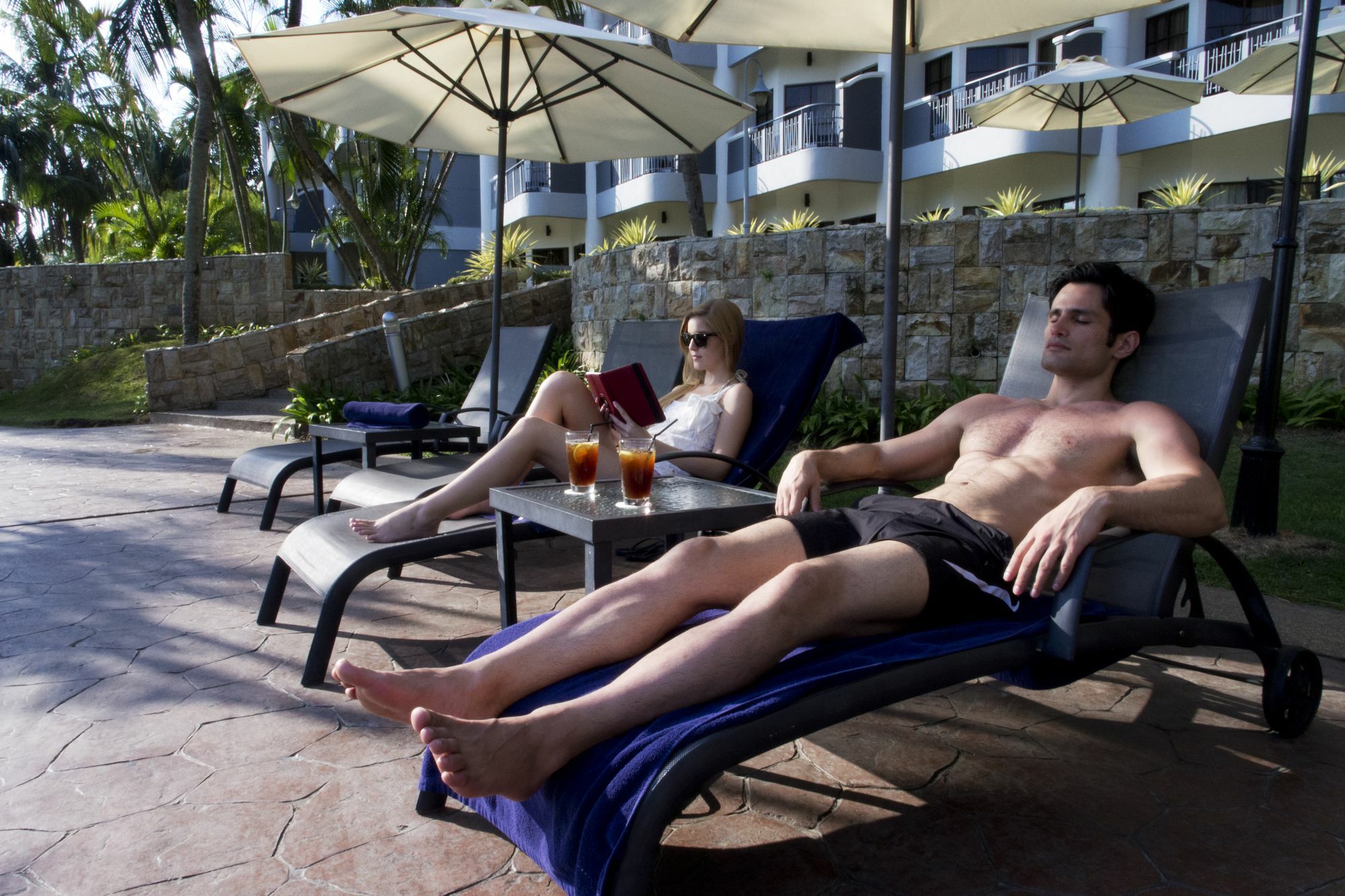 Thistle Port Dickson Resort Kültér fotó Sunbathers at a resort in Fiji